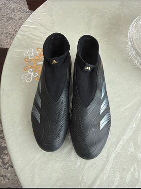 adidas Men’s Black Slip-On Laceless Athletic Soccer Shoes with Silver Stripes
